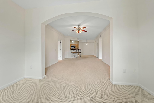 interior space with light colored carpet and ornamental molding