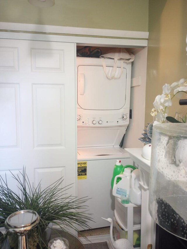 laundry room with stacked washer and dryer