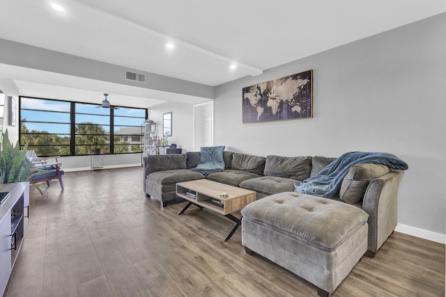 living room with ceiling fan and hardwood / wood-style flooring