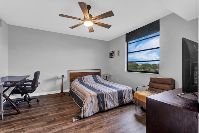 bedroom with ceiling fan and dark hardwood / wood-style floors