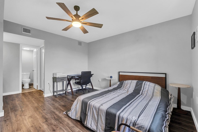 bedroom featuring ceiling fan, dark wood-type flooring, and ensuite bath