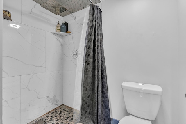 bathroom with toilet and curtained shower