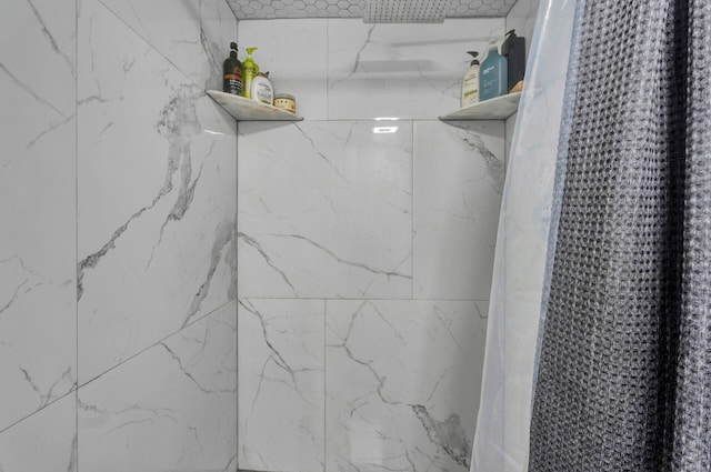 bathroom featuring a shower with curtain