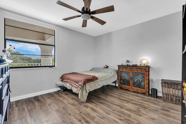 bedroom featuring dark hardwood / wood-style floors and ceiling fan