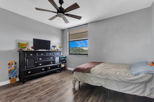 bedroom featuring ceiling fan and dark hardwood / wood-style flooring