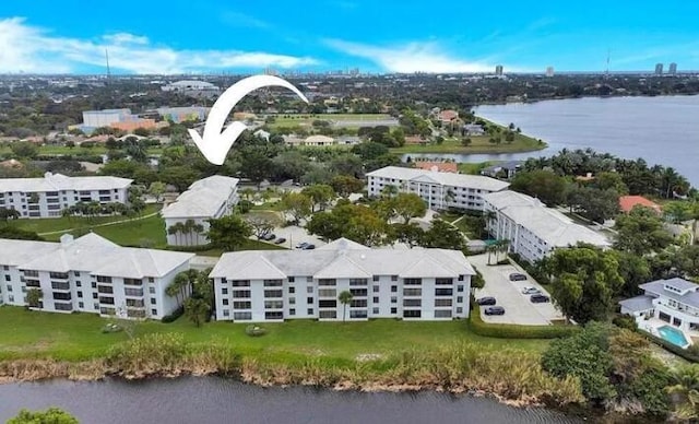 birds eye view of property with a water view