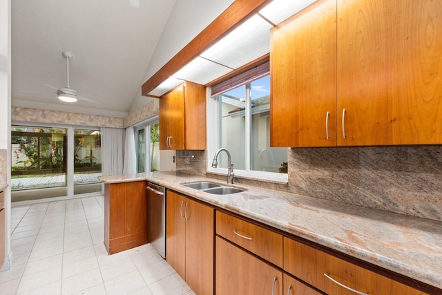 kitchen with sink, stainless steel dishwasher, vaulted ceiling, decorative backsplash, and light tile patterned flooring