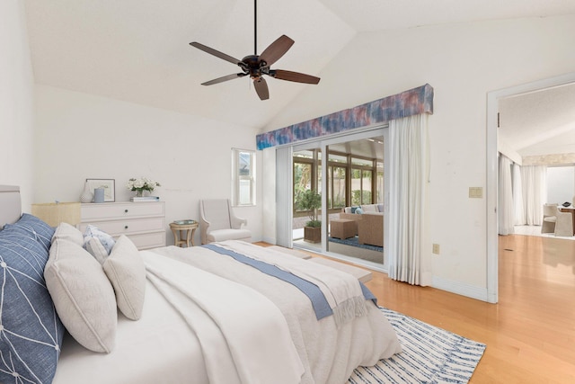 bedroom featuring access to outside, ceiling fan, light hardwood / wood-style floors, and vaulted ceiling