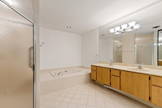 bathroom featuring tile patterned flooring, vanity, and independent shower and bath