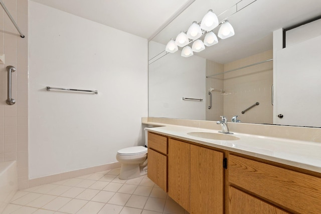 bathroom featuring tile patterned floors, vanity, and toilet