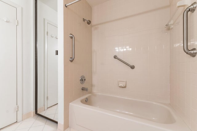 bathroom featuring tile patterned flooring and tiled shower / bath combo