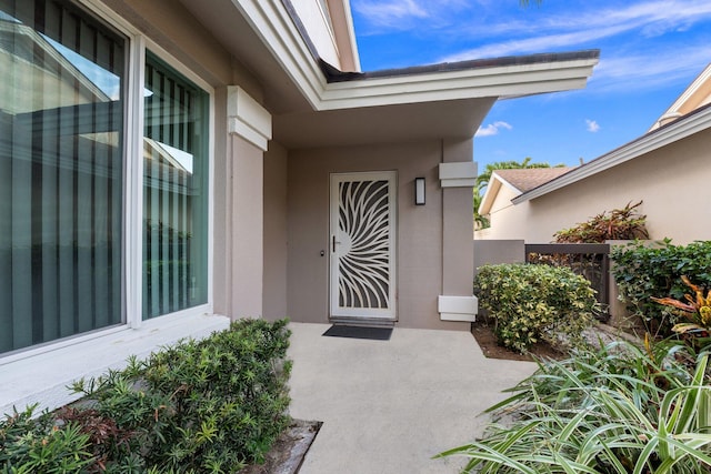 property entrance featuring a patio