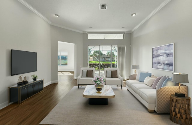 living area with ornamental molding, wood finished floors, visible vents, and baseboards