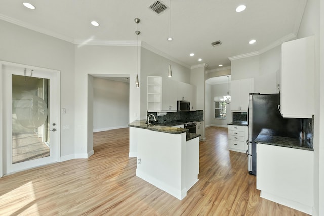 kitchen with open shelves, white cabinetry, visible vents, and stainless steel appliances