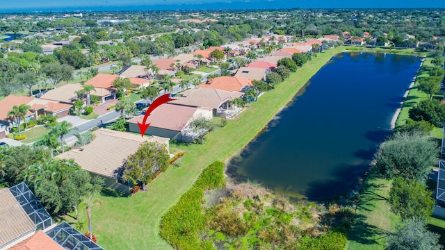 drone / aerial view featuring a residential view and a water view