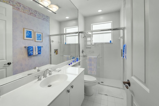 full bath featuring toilet, a stall shower, tile patterned flooring, and vanity