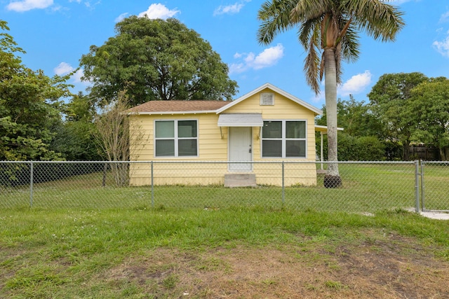 view of front of home with a front yard