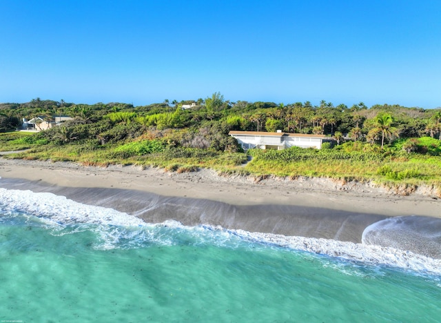 aerial view with a water view and a beach view