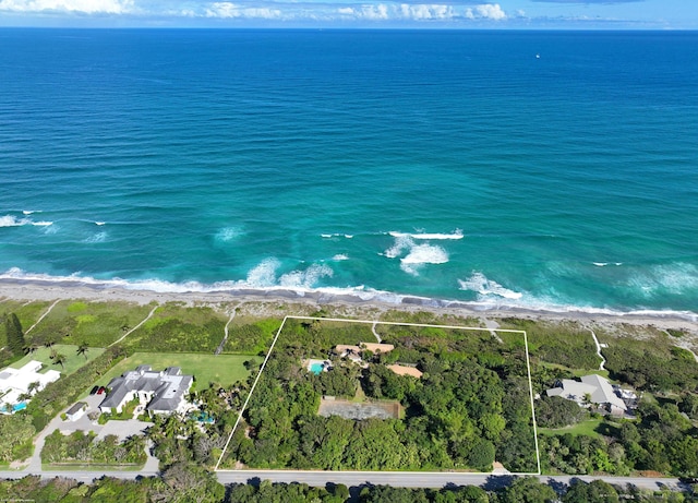 aerial view featuring a view of the beach and a water view