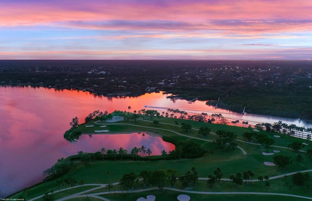 aerial view at dusk with a water view