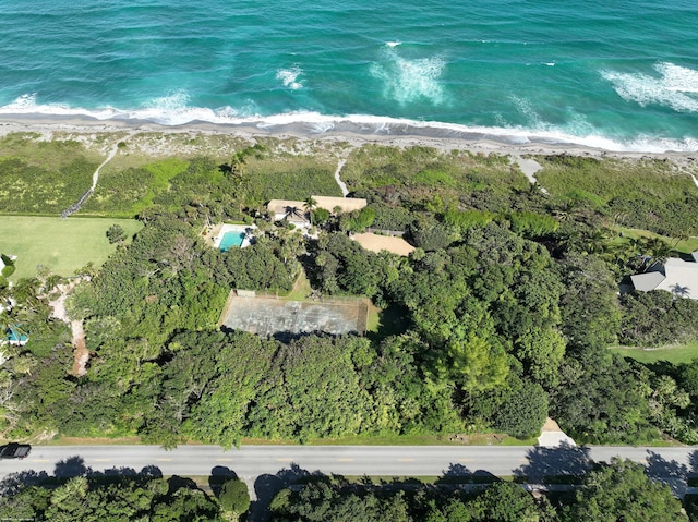 aerial view with a water view and a beach view