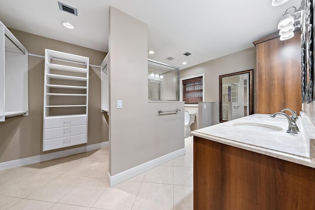 bathroom with vanity and tile patterned floors