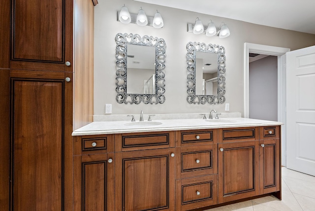 bathroom with vanity and tile patterned flooring