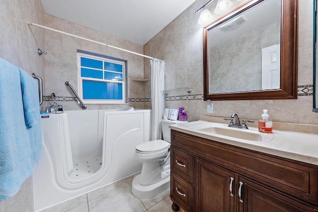 full bathroom with tile walls, vanity, plus walk in shower, decorative backsplash, and tile patterned floors