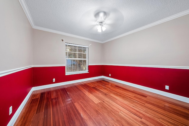 unfurnished room featuring a textured ceiling, hardwood / wood-style flooring, ceiling fan, and crown molding