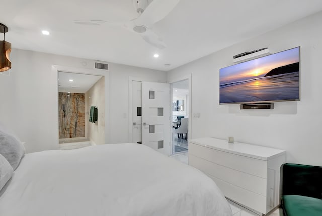 bedroom with ensuite bathroom and ceiling fan