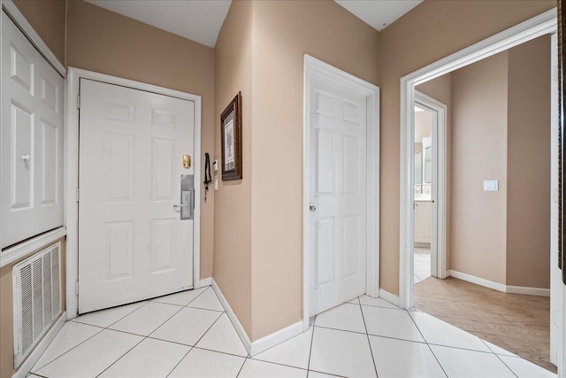 interior space with light tile patterned floors