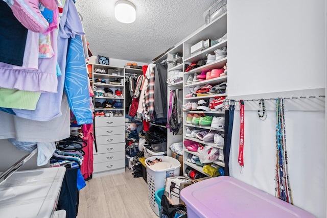 walk in closet featuring light wood-type flooring