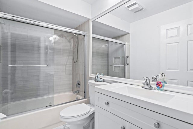 full bathroom featuring vanity, toilet, and enclosed tub / shower combo