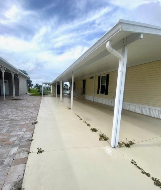 exterior space with a carport