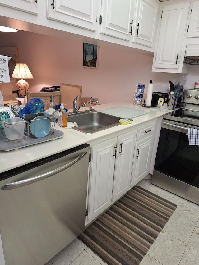 kitchen with ventilation hood, sink, light tile patterned floors, white cabinetry, and stainless steel appliances