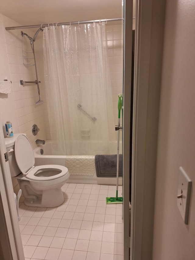 bathroom featuring tile patterned floors, shower / bath combo, and toilet