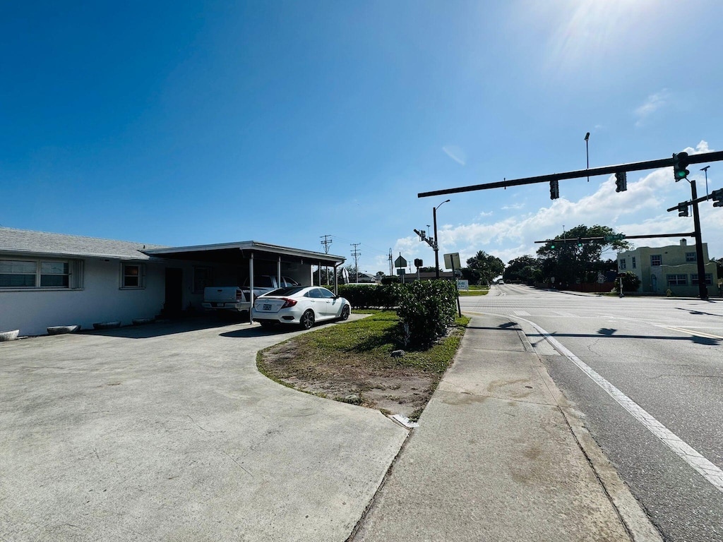 view of front of home with a carport