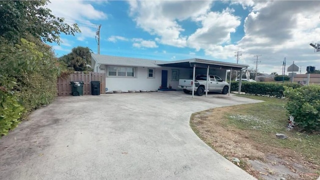 view of front of home with a carport