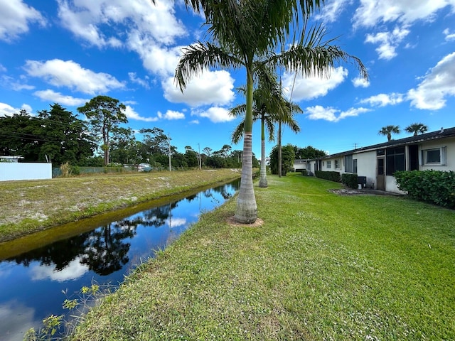 exterior space with a water view