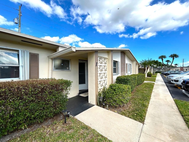 2522 Emory Dr E Unit I, West Palm Beach, FL 33415 - doorway to property featuring stucco siding
