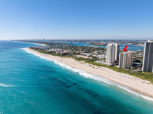 birds eye view of property with a view of the beach and a water view