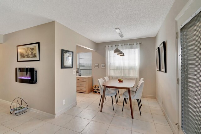 tiled dining area with a textured ceiling