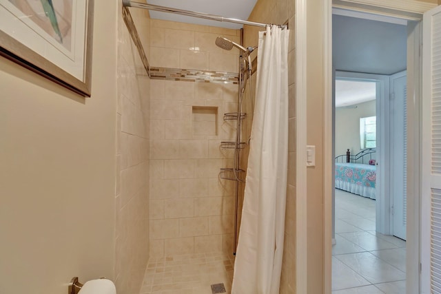 bathroom featuring tile patterned floors and walk in shower