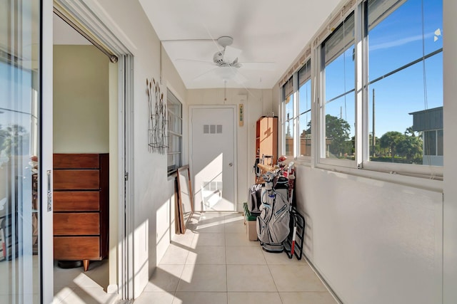 corridor featuring light tile patterned floors