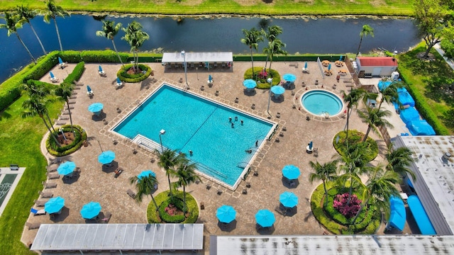 birds eye view of property with a water view