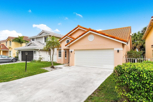 view of front of house with a garage and a front lawn