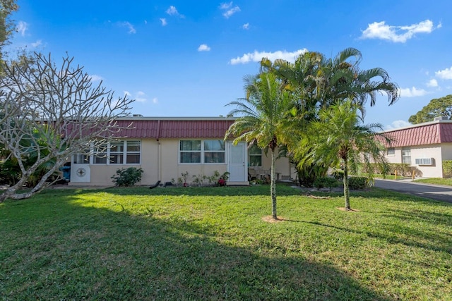 single story home with a front yard