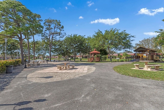 surrounding community featuring a gazebo and a playground