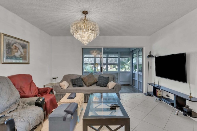 living room with light tile patterned floors, a textured ceiling, and an inviting chandelier