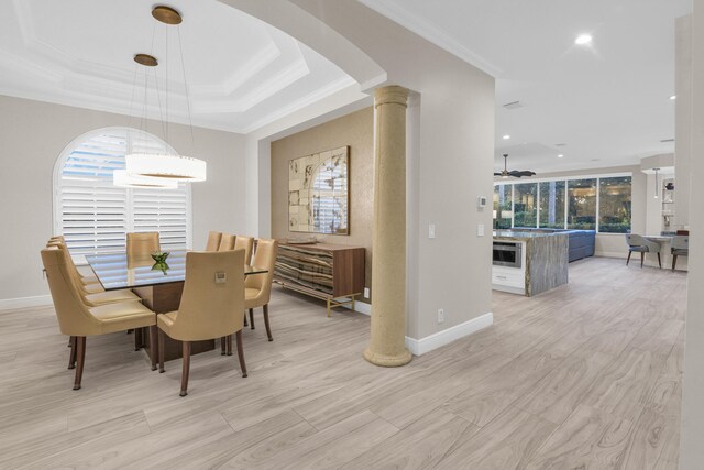 dining area with ornamental molding and light wood-type flooring